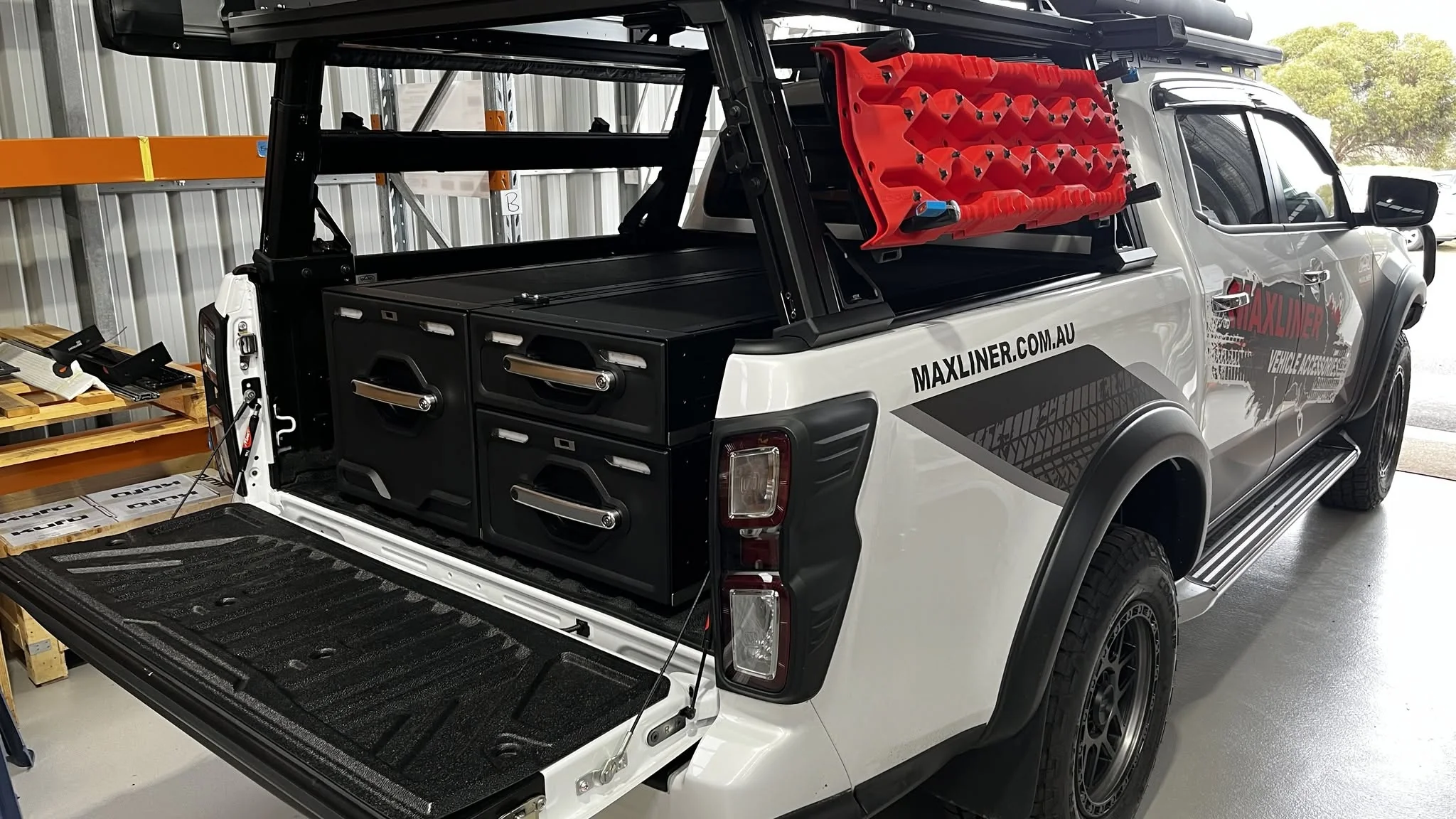 Pickup-truck storage drawers and utility equipment photographed in situ.